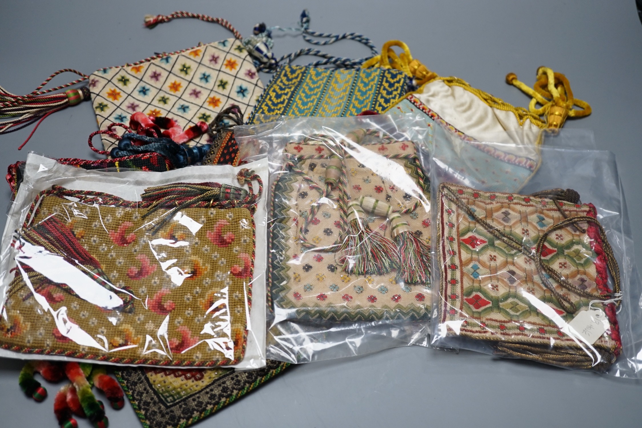 Ten 19th century embroidered and woolworked bible bags, largest 18 x 16cm